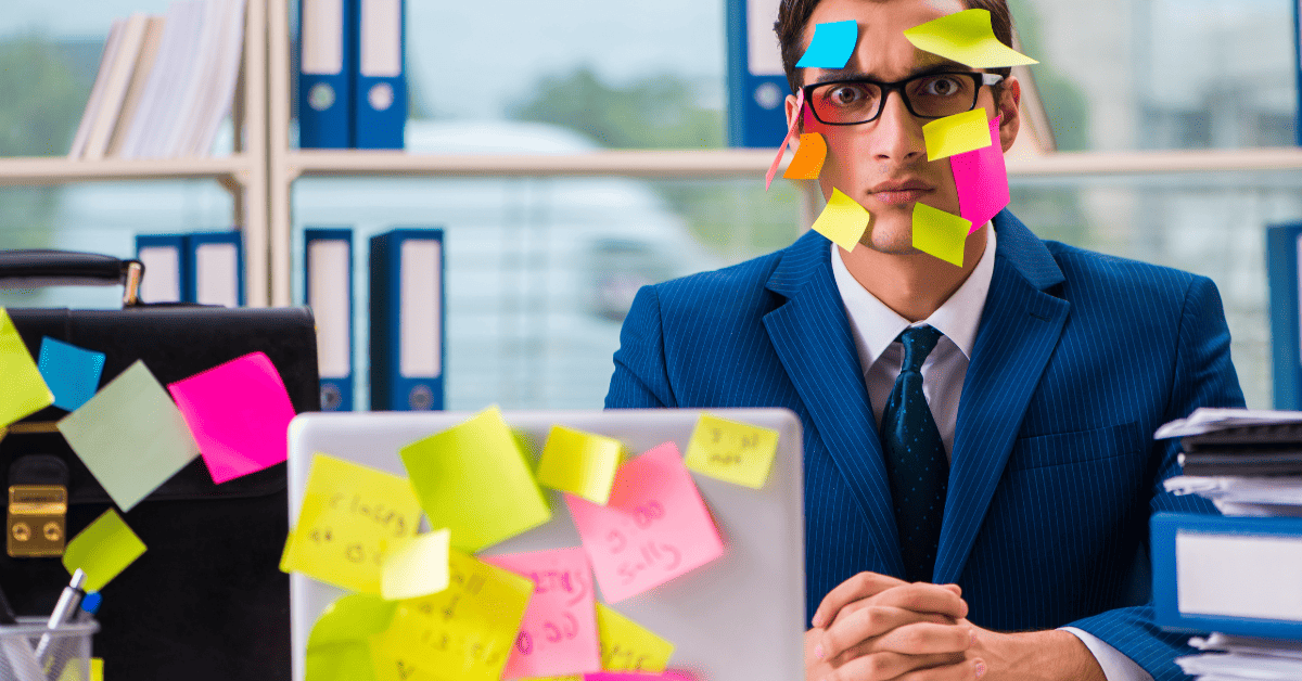 A multitasking man covered in sticky notes