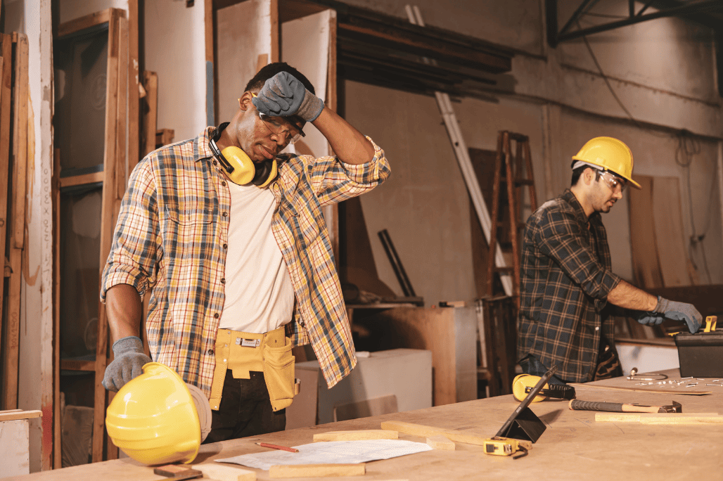 A worker sweating from the heat